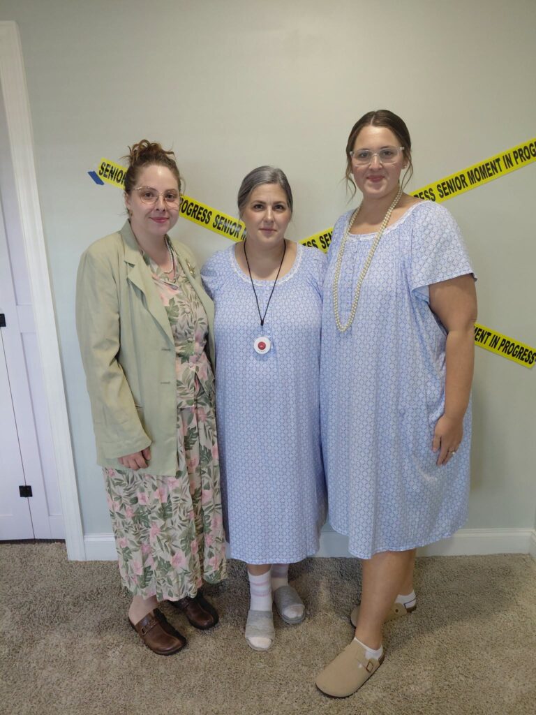 Three Corky team members dressed up together for a fun school spirit day
